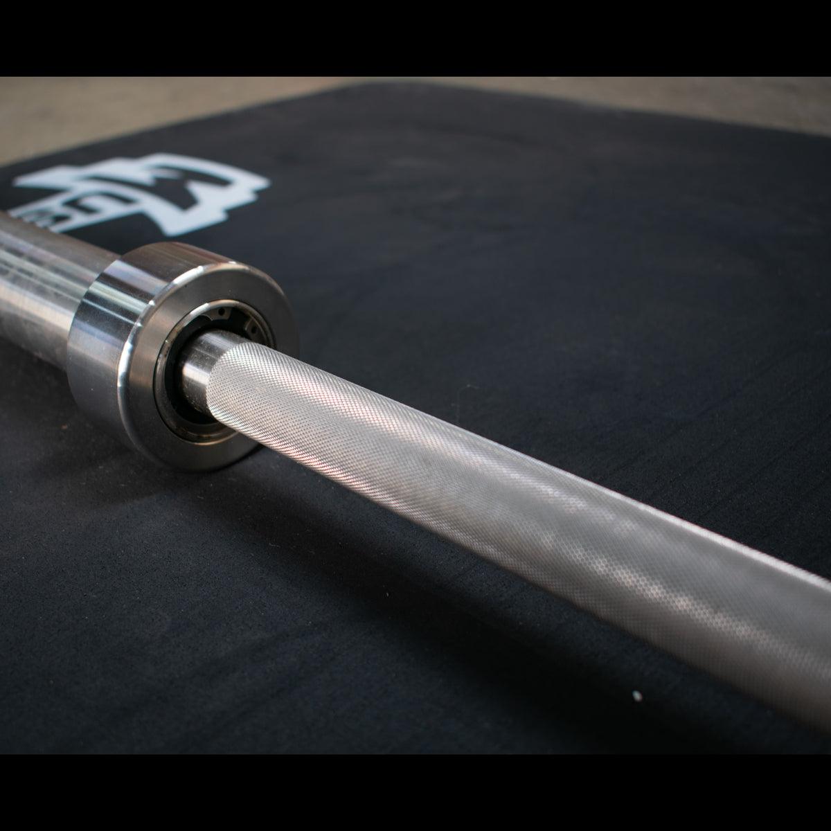 Muscle D Fitness - 7' Stainless Steel Olympic Bar - Bearing - Quality Knurling