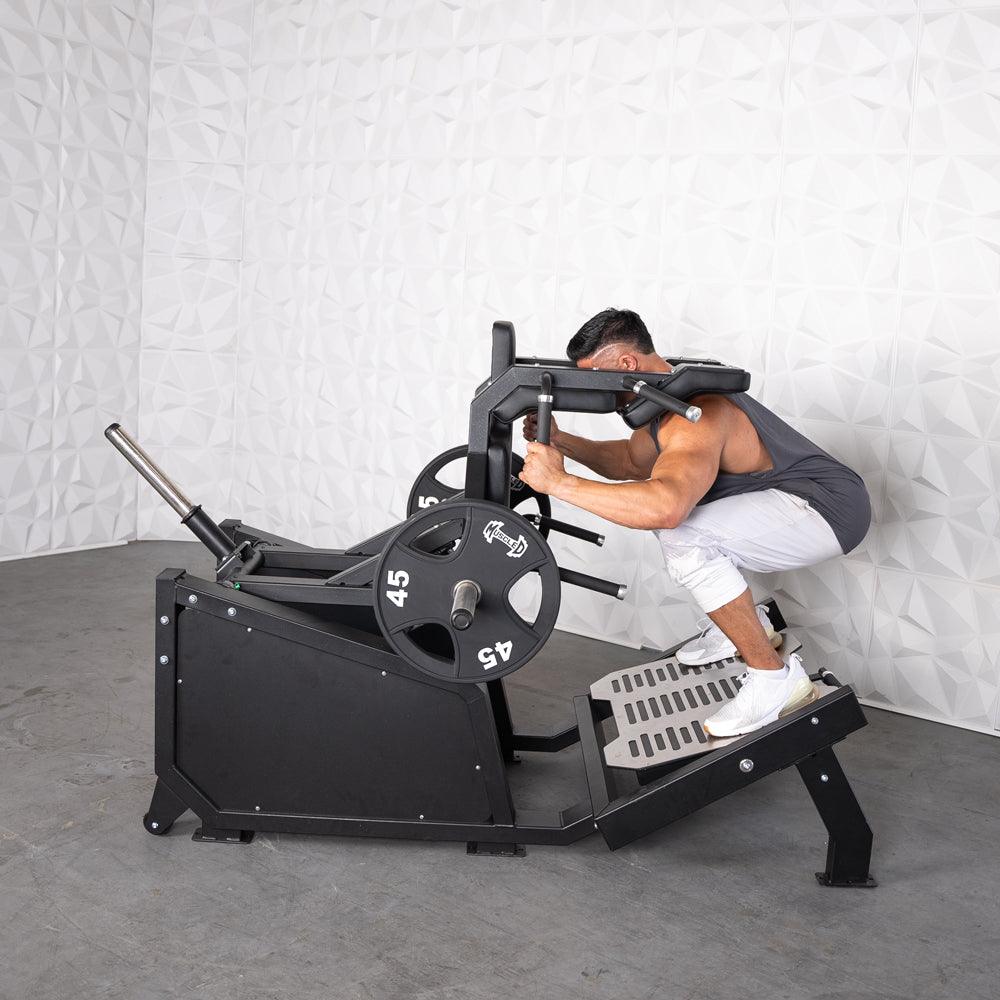 Muscle D Fitness - Excel Glute Line Hack Squat - Front Squat - Plate Load Squat Machine - Counter Balanced - Plate Storage Pegs