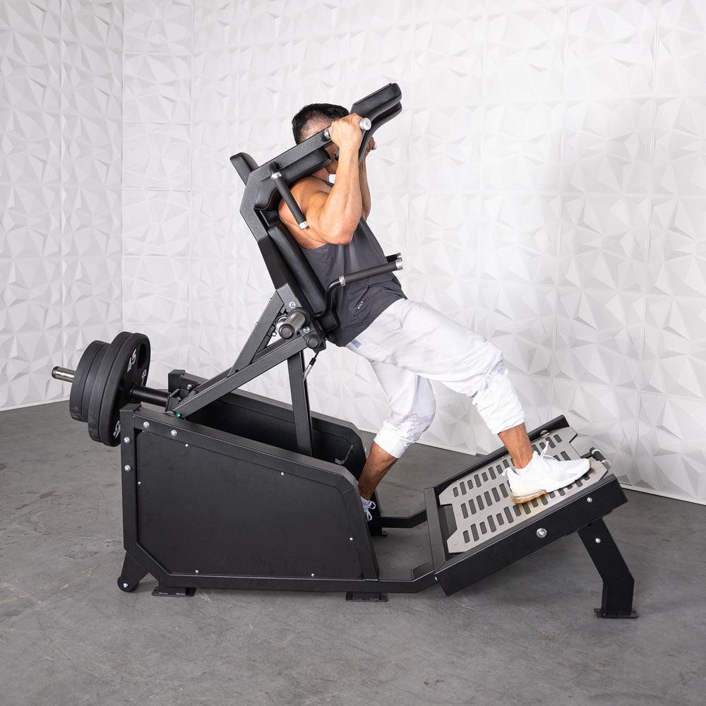 Muscle D Fitness - Excel Glute Line Hack Squat - Front Squat - Plate Load Squat Machine - Counter Balanced - Plate Storage Pegs